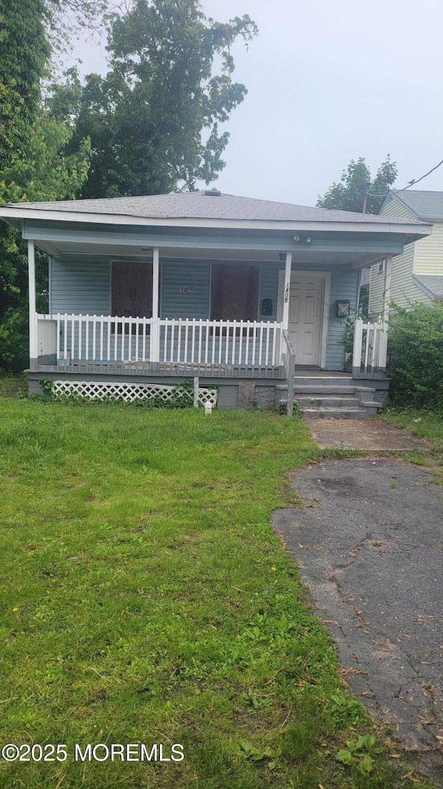 1405 Mattison Ave, Asbury Park, NJ 07712 - view of front of home with covered porch and a front lawn