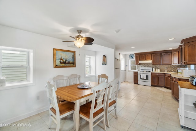 dining room with ceiling fan, light tile patterned floors, baseboards, and recessed lighting