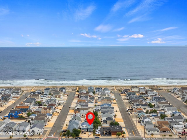 aerial view of residential area with unending shoreline