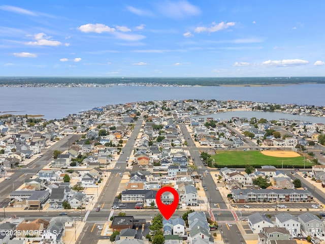 view of property location featuring nearby suburban area and a nearby body of water