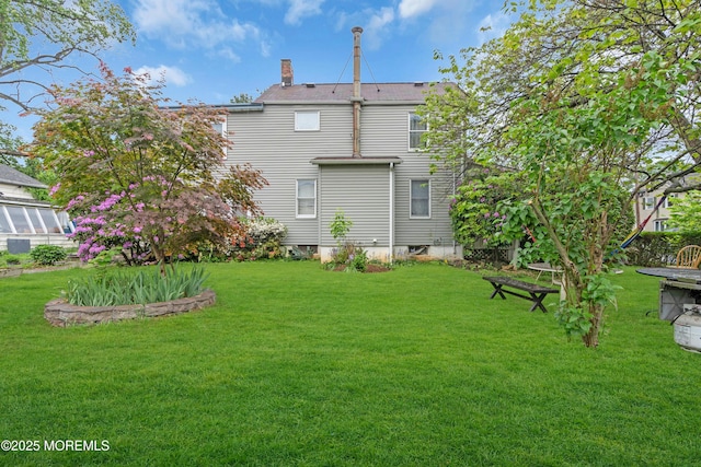 19 Union Ave, Freehold, NJ 07728 - rear view of property with a chimney and a yard