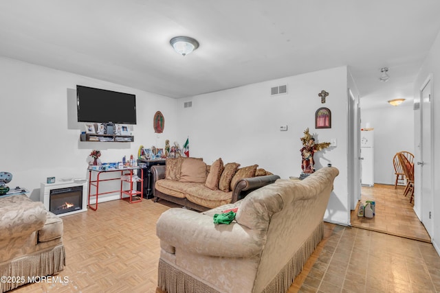 11 Factory St, Freehold, NJ 07728 - living room featuring a glass covered fireplace