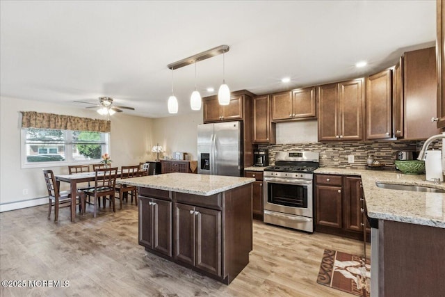 19 Acapulco Dr, Brick, NJ 08723 - kitchen with appliances with stainless steel finishes, a sink, a ceiling fan, a center island, and light wood-style flooring