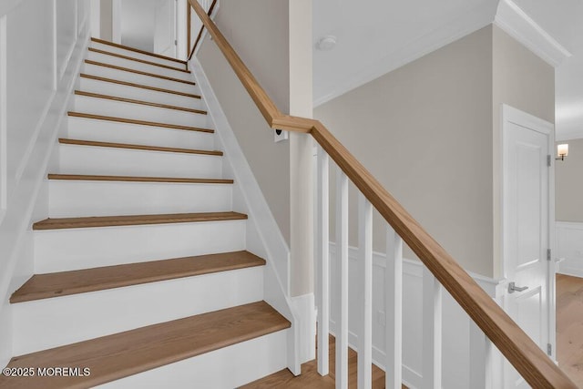 staircase with wood finished floors