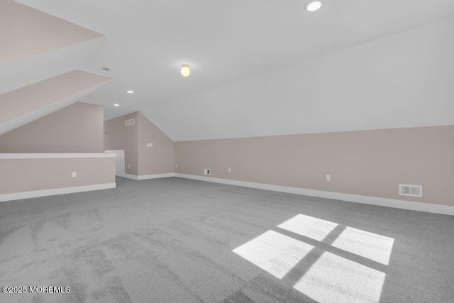 additional living space with lofted ceiling, carpet, recessed lighting, and baseboards