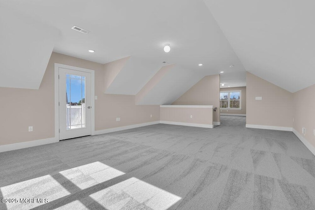 bonus room with carpet floors, lofted ceiling, baseboards, and recessed lighting