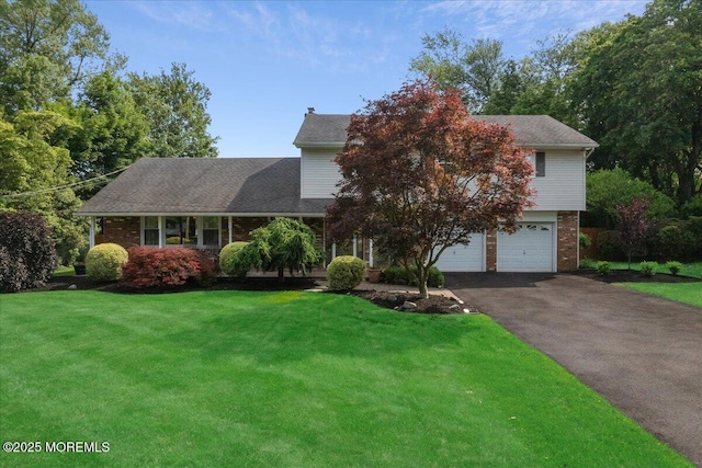 19 Meadowbrook Ln, Freehold, NJ 07728 - view of front of property with asphalt driveway, a front yard, a garage, and brick siding