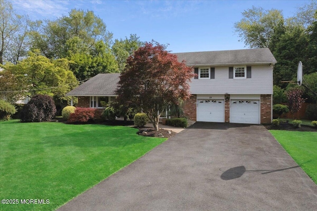 19 Meadowbrook Ln, Freehold, NJ 07728 - view of front of home with driveway, a garage, a front lawn, and brick siding