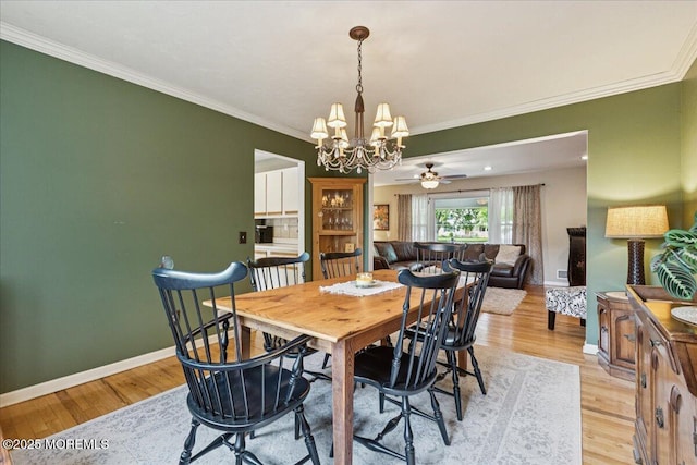 19 Meadowbrook Ln, Freehold, NJ 07728 - dining area with a chandelier, light wood-type flooring, ornamental molding, and baseboards