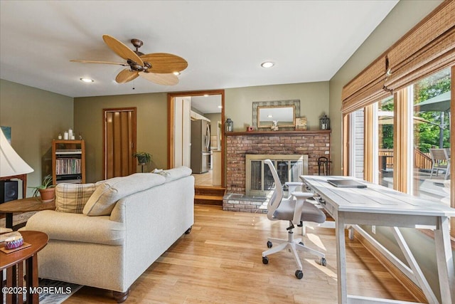 19 Meadowbrook Ln, Freehold, NJ 07728 - office space featuring light wood-style floors, a fireplace, a ceiling fan, and recessed lighting
