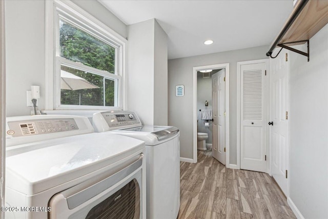 19 Meadowbrook Ln, Freehold, NJ 07728 - washroom with washing machine and dryer, light wood-type flooring, baseboards, and recessed lighting
