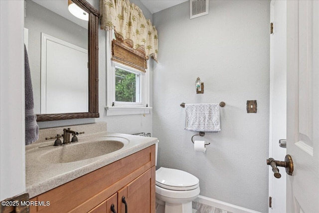 19 Meadowbrook Ln, Freehold, NJ 07728 - bathroom featuring vanity, toilet, and baseboards