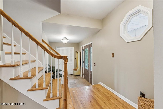 19 Meadowbrook Ln, Freehold, NJ 07728 - foyer with wood finished floors, stairs, and baseboards