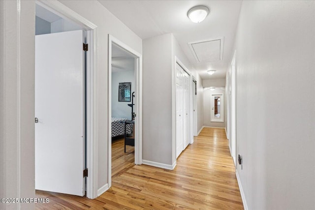 19 Meadowbrook Ln, Freehold, NJ 07728 - corridor with attic access, light wood-style flooring, and baseboards
