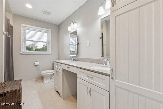 19 Meadowbrook Ln, Freehold, NJ 07728 - bathroom featuring double vanity, toilet, tile patterned flooring, and baseboards