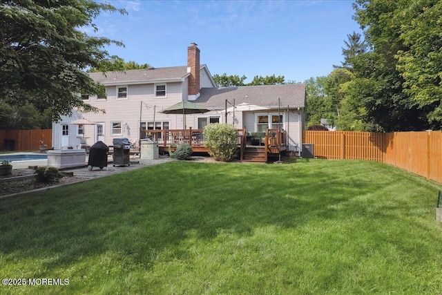 19 Meadowbrook Ln, Freehold, NJ 07728 - back of house with a wooden deck, a chimney, and central AC