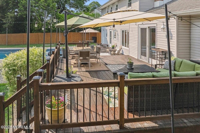 19 Meadowbrook Ln, Freehold, NJ 07728 - deck with outdoor dining space, a fenced backyard, and outdoor lounge area