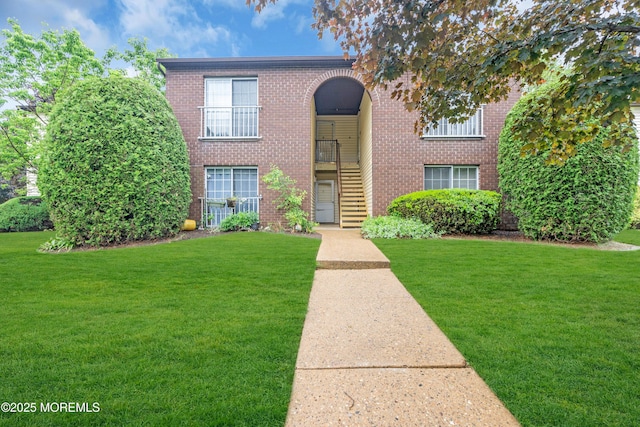 716 Zlotkin Cir Unit 1, Freehold, NJ 07728 - view of front of property featuring a front yard and brick siding