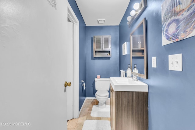 716 Zlotkin Cir Unit 1, Freehold, NJ 07728 - bathroom with toilet, baseboards, and vanity