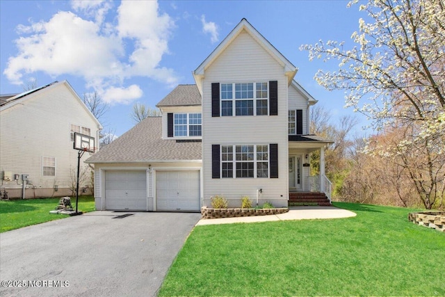 34 Crescent Rd, Old Bridge, NJ 08857 - traditional home with asphalt driveway, an attached garage, a front lawn, and roof with shingles