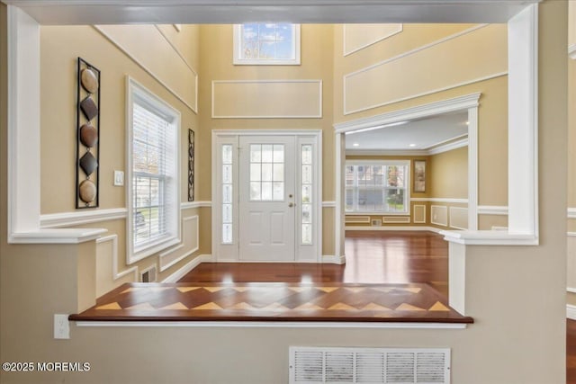 34 Crescent Rd, Old Bridge, NJ 08857 - entryway with a decorative wall, wood finished floors, healthy amount of natural light, and a wainscoted wall