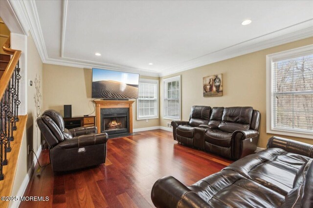 34 Crescent Rd, Old Bridge, NJ 08857 - living area featuring healthy amount of natural light, wood finished floors, ornamental molding, a fireplace, and baseboards