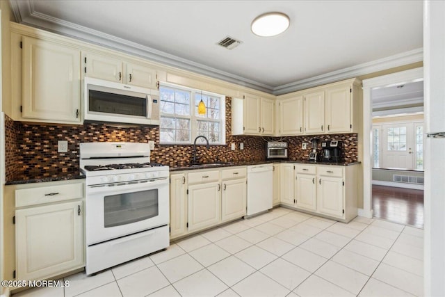 34 Crescent Rd, Old Bridge, NJ 08857 - kitchen with white appliances, cream cabinetry, a sink, plenty of natural light, and ornamental molding