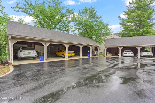 view of vehicle parking with a garage
