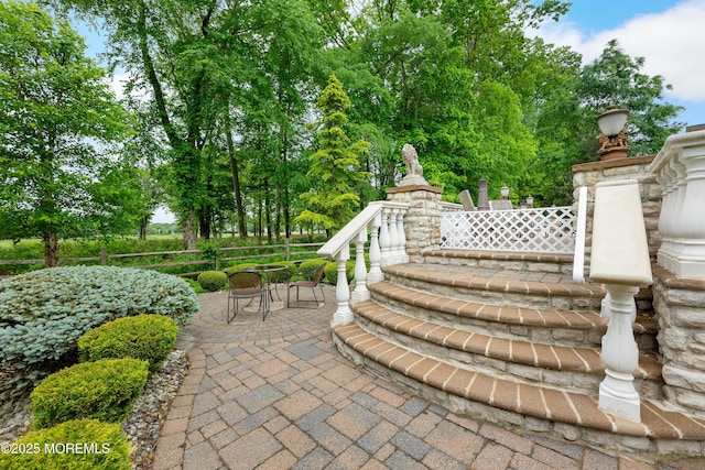 68 Hedgerow Ln, Manalapan, NJ 07726 - view of patio featuring fence and view of scattered trees