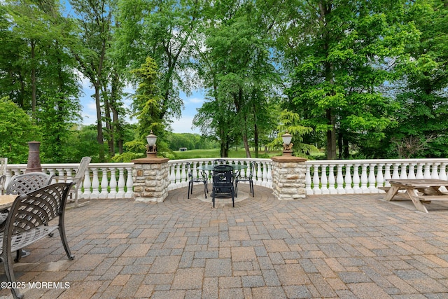 68 Hedgerow Ln, Manalapan, NJ 07726 - view of patio / terrace with outdoor dining area and view of wooded area