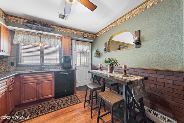 22 Fir Rd Unit 25, Manahawkin, NJ 08050 - kitchen with dishwasher, a sink, ceiling fan, wood finished floors, and wainscoting