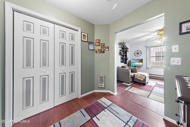 22 Fir Rd Unit 25, Manahawkin, NJ 08050 - hallway with wood finished floors, baseboard heating, baseboards, and heating unit