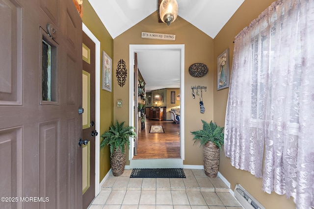 22 Fir Rd Unit 25, Manahawkin, NJ 08050 - foyer featuring light tile patterned flooring, lofted ceiling, baseboards, and baseboard heating