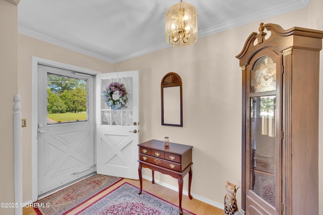 1223 Clover Rd, Brick, NJ 08724 - entryway with wood finished floors, a chandelier, baseboards, and ornamental molding