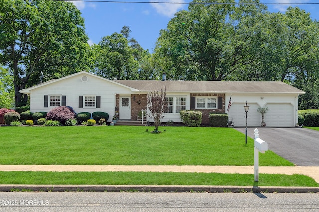 1223 Clover Rd, Brick, NJ 08724 - ranch-style house with a garage, asphalt driveway, and a front yard