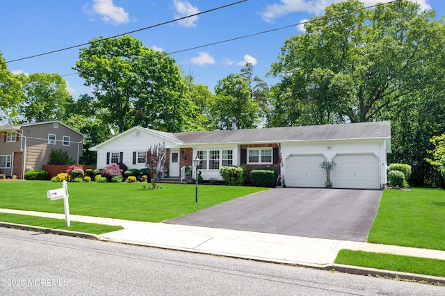 1223 Clover Rd, Brick, NJ 08724 - ranch-style home featuring a garage, asphalt driveway, and a front yard