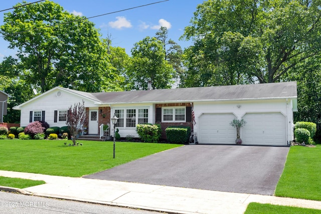1223 Clover Rd, Brick, NJ 08724 - ranch-style home featuring an attached garage, driveway, a front yard, and brick siding