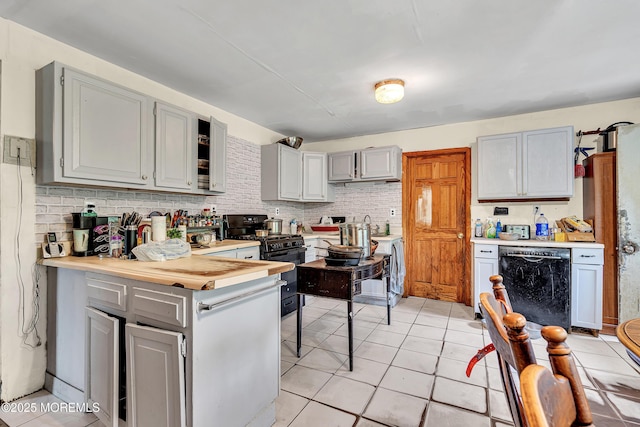 211 Long Swamp Rd, New Egypt, NJ 08533 - kitchen featuring black appliances, light countertops, gray cabinetry, a peninsula, and light tile patterned floors