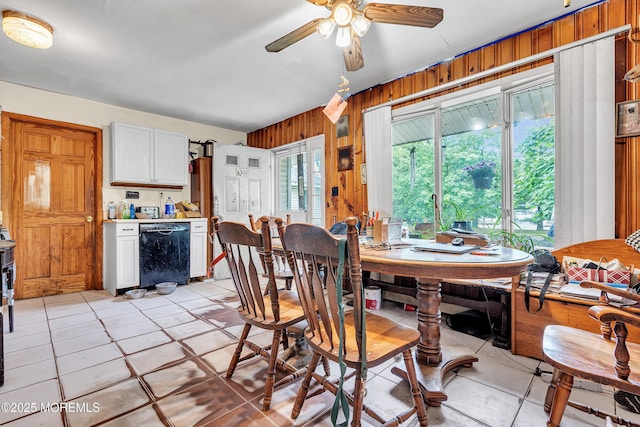 211 Long Swamp Rd, New Egypt, NJ 08533 - dining space featuring wooden walls, ceiling fan, and light tile patterned flooring