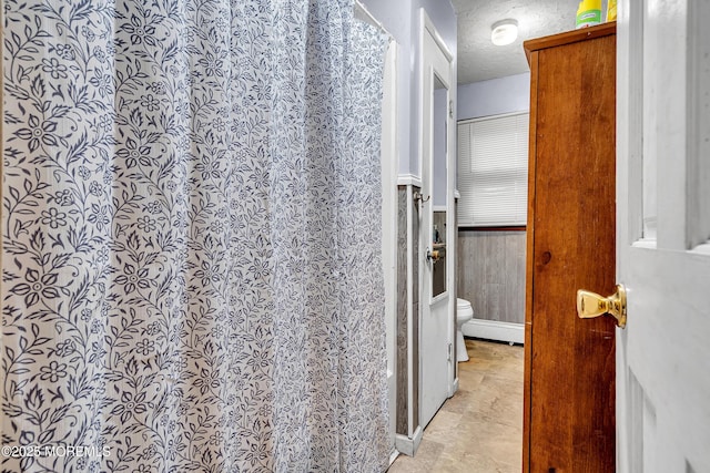 211 Long Swamp Rd, New Egypt, NJ 08533 - full bath featuring toilet, a textured ceiling, curtained shower, and wainscoting