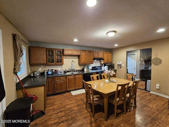 211 Long Swamp Rd, New Egypt, NJ 08533 - kitchen featuring under cabinet range hood, dark wood finished floors, a sink, glass insert cabinets, and stainless steel microwave