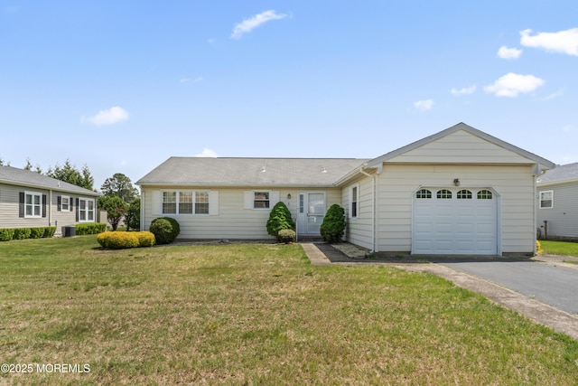 single story home featuring a garage, driveway, a front yard, and central air condition unit