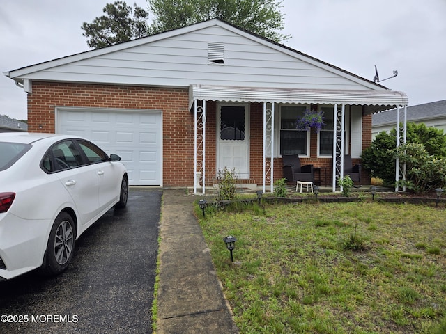 15 Roxton Pl, Toms River, NJ 08757 - view of front of property with brick siding, a garage, and asphalt driveway