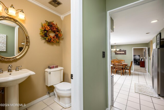 3 Romero Ct, Monroe, NJ 08831 - bathroom with tile patterned flooring, toilet, baseboards, a chandelier, and ornamental molding