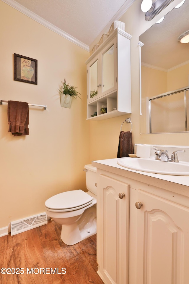 39 Goldenrod Pl, Jackson, NJ 08527 - full bathroom featuring ornamental molding, wood finished floors, a stall shower, vanity, and toilet