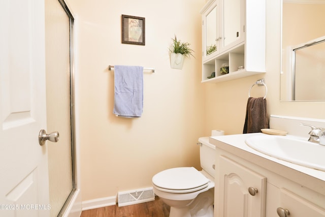 39 Goldenrod Pl, Jackson, NJ 08527 - bathroom with a shower with door, toilet, vanity, wood finished floors, and baseboards