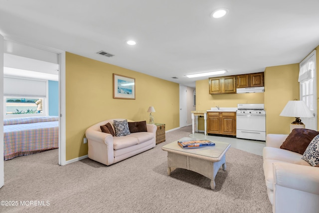 817 S Ocean Ave, Seaside Park, NJ 08752 - living area featuring light carpet, recessed lighting, and baseboards