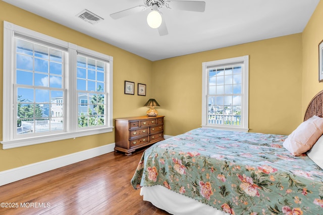 817 S Ocean Ave, Seaside Park, NJ 08752 - bedroom with hardwood / wood-style flooring, baseboards, and a ceiling fan