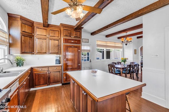 817 S Ocean Ave, Seaside Park, NJ 08752 - kitchen featuring a sink, dark wood-style floors, a ceiling fan, light countertops, and a textured ceiling