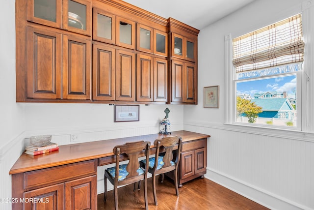 817 S Ocean Ave, Seaside Park, NJ 08752 - home office featuring built in desk, wood finished floors, and wainscoting